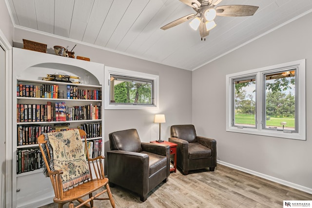 112 W Lakeshore Dr, Lincoln, NE 68528 - sitting room with crown molding, wood finished floors, ceiling fan, lofted ceiling, and baseboards