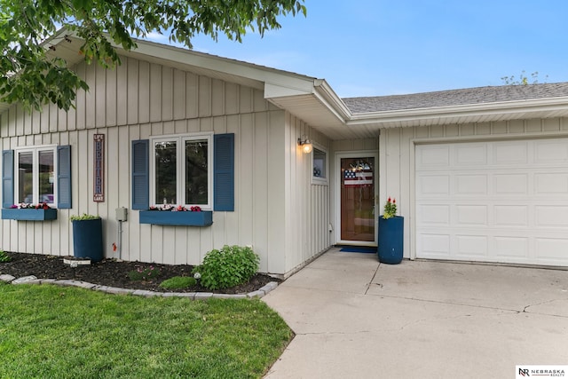 112 W Lakeshore Dr, Lincoln, NE 68528 - ranch-style house with a garage, concrete driveway, and a shingled roof