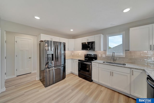 3556 Pearl Crescent Dr, Lincoln, NE 68504 - kitchen with appliances with stainless steel finishes, a sink, light wood-type flooring, light stone counters, and recessed lighting