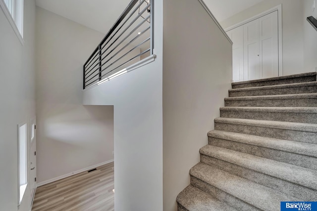 3556 Pearl Crescent Dr, Lincoln, NE 68504 - staircase with wood finished floors and a high ceiling