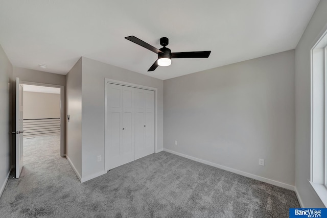 3556 Pearl Crescent Dr, Lincoln, NE 68504 - unfurnished bedroom with carpet floors, baseboards, a closet, and ceiling fan