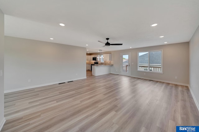 3556 Pearl Crescent Dr, Lincoln, NE 68504 - unfurnished living room with baseboards, light wood-style floors, recessed lighting, and a ceiling fan