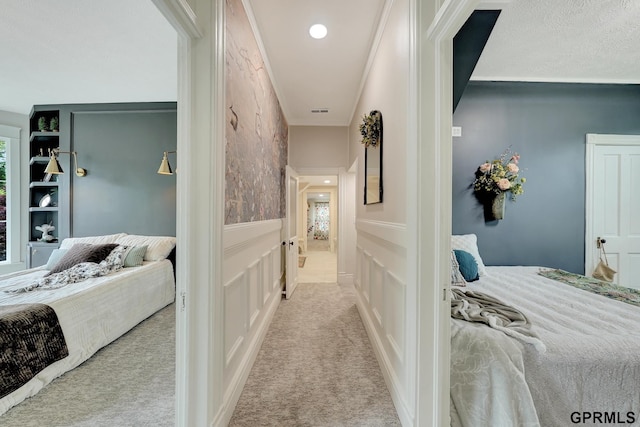 149 N 1st St, Seward, NE 68434 - hallway with carpet floors, a wainscoted wall, a decorative wall, and recessed lighting