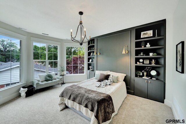 149 N 1st St, Seward, NE 68434 - carpeted bedroom featuring a chandelier, multiple windows, and baseboards