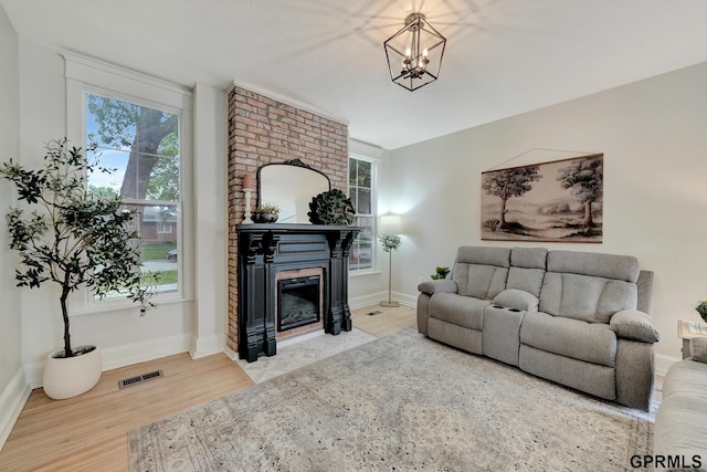 149 N 1st St, Seward, NE 68434 - living area with a large fireplace, plenty of natural light, and wood finished floors