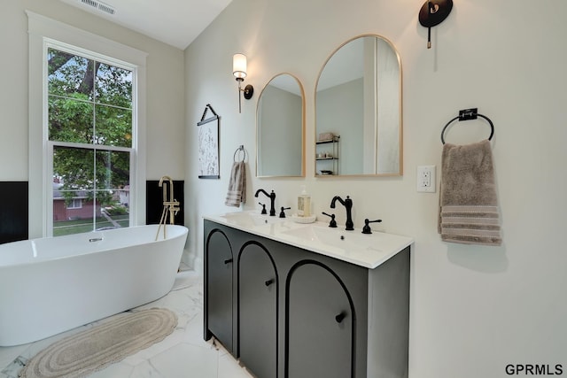 149 N 1st St, Seward, NE 68434 - full bath with marble look tiles, a soaking tub, and double vanity