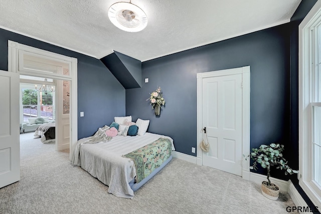 149 N 1st St, Seward, NE 68434 - carpeted bedroom with a textured ceiling and baseboards