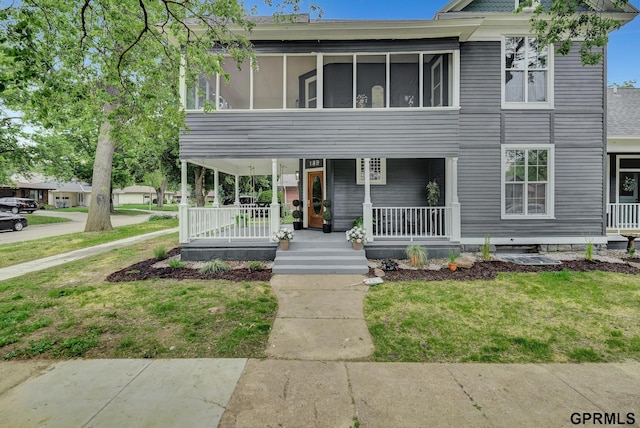 149 N 1st St, Seward, NE 68434 - view of front facade featuring a porch and a front yard