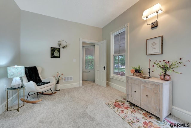 149 N 1st St, Seward, NE 68434 - living area featuring baseboards and light carpet