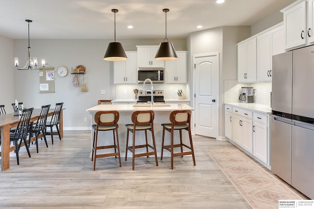 8622 N 177th St, Bennington, NE 68007 - kitchen featuring appliances with stainless steel finishes, recessed lighting, light countertops, backsplash, and light wood-style floors