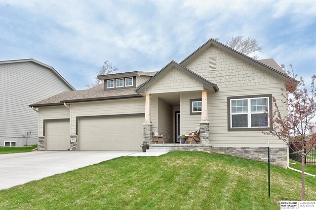 8622 N 177th St, Bennington, NE 68007 - craftsman-style home with an attached garage, concrete driveway, a front lawn, stone siding, and a shingled roof