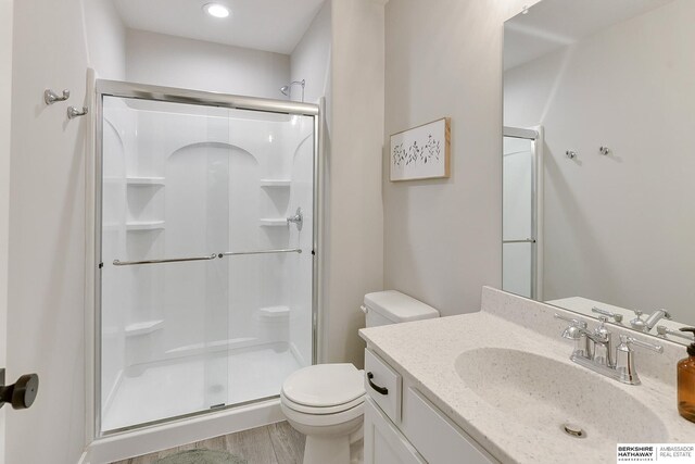 8622 N 177th St, Bennington, NE 68007 - bathroom featuring a shower stall, toilet, vanity, and wood finished floors