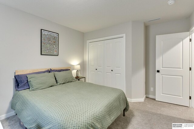 8622 N 177th St, Bennington, NE 68007 - bedroom with baseboards, a closet, and light colored carpet