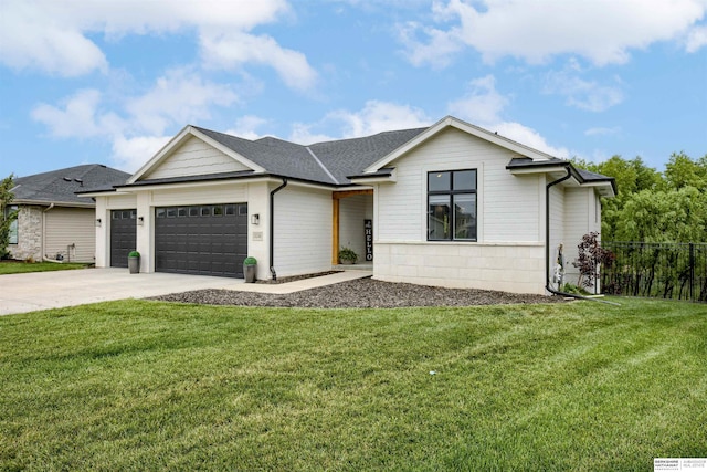 18244 Cheyenne Rd, Omaha, NE 68136 - view of front of home with a garage, driveway, and a shingled roof