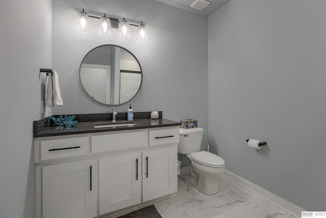 18244 Cheyenne Rd, Omaha, NE 68136 - bathroom featuring toilet, vanity, baseboards, and marble finish floors