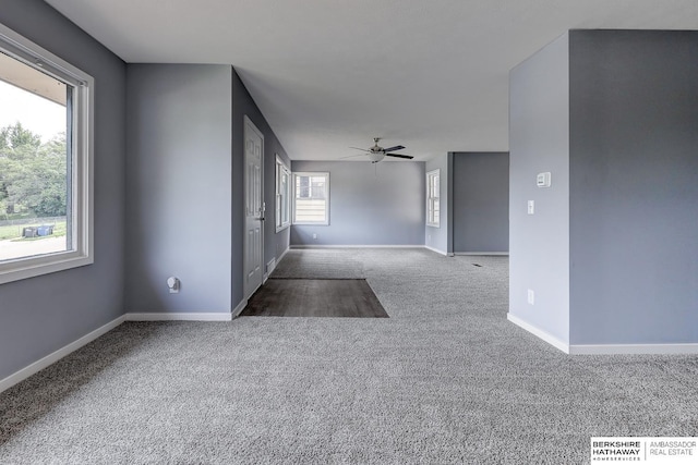 4207 Camden Ave, Omaha, NE 68111 - empty room featuring carpet floors, baseboards, and ceiling fan