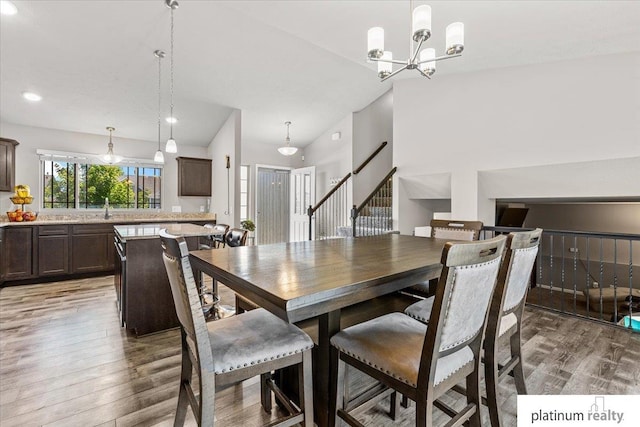 7784 N 88th Ave, Omaha, NE 68122 - dining room with light wood-style floors, stairs, a chandelier, and recessed lighting