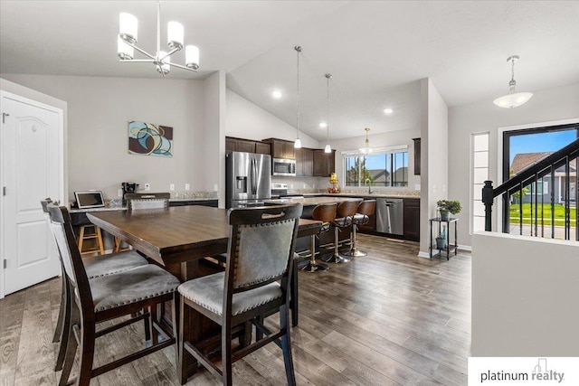 7784 N 88th Ave, Omaha, NE 68122 - dining space featuring a chandelier, dark wood-style floors, recessed lighting, and high vaulted ceiling