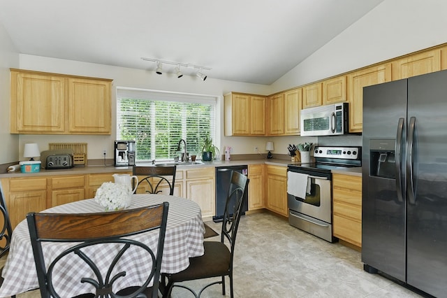 7628 Bondesson St, Omaha, NE 68122 - kitchen featuring appliances with stainless steel finishes, a sink, light brown cabinets, light countertops, and lofted ceiling