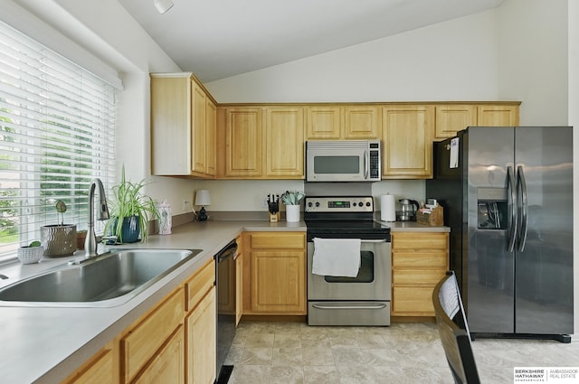 7628 Bondesson St, Omaha, NE 68122 - kitchen featuring stainless steel appliances, a sink, lofted ceiling, light brown cabinets, and light countertops
