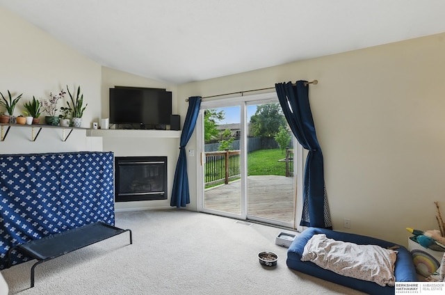 7628 Bondesson St, Omaha, NE 68122 - carpeted living area featuring lofted ceiling and a glass covered fireplace