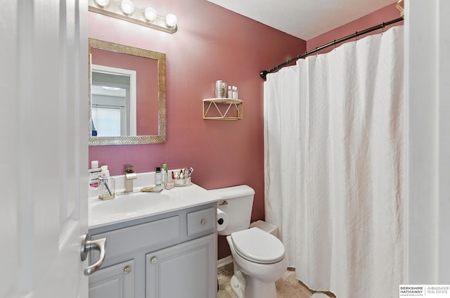 7628 Bondesson St, Omaha, NE 68122 - bathroom featuring toilet, vanity, curtained shower, and tile patterned flooring