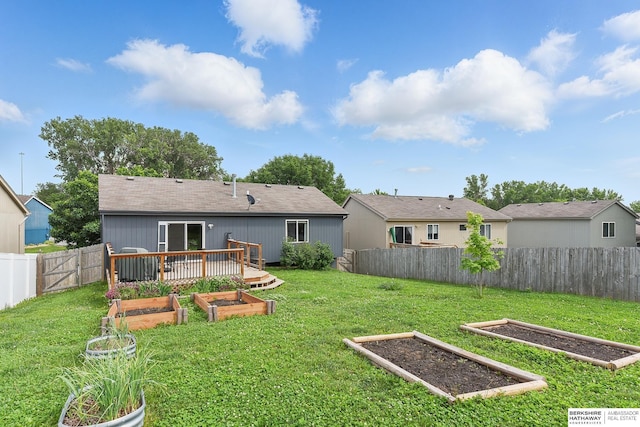 7628 Bondesson St, Omaha, NE 68122 - rear view of property with a vegetable garden
