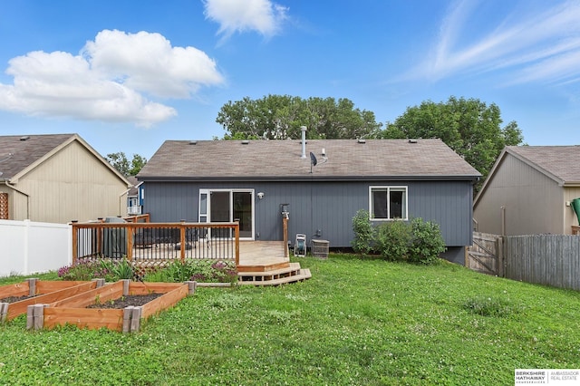 7628 Bondesson St, Omaha, NE 68122 - rear view of property with a vegetable garden, a deck, and a shingled roof