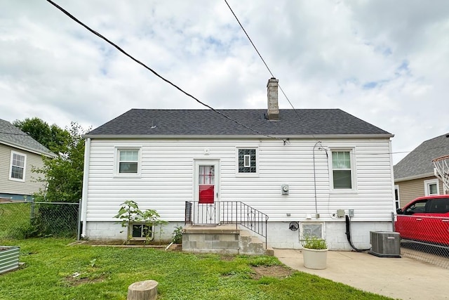 3869 Arbor St, Omaha, NE 68105 - back of property featuring a chimney and central AC