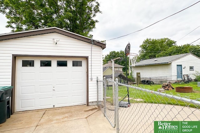 3869 Arbor St, Omaha, NE 68105 - detached garage featuring concrete driveway and a gate