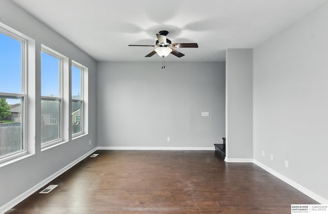 8925 N 159th Ave, Bennington, NE 68007 - unfurnished room with ceiling fan, dark wood-style flooring, and baseboards
