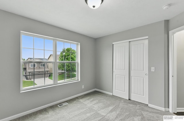 8925 N 159th Ave, Bennington, NE 68007 - unfurnished bedroom featuring baseboards, carpet floors, and a closet