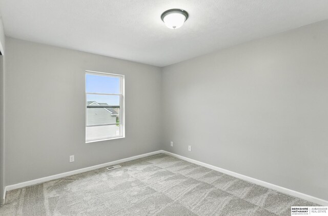 8925 N 159th Ave, Bennington, NE 68007 - empty room with baseboards and carpet