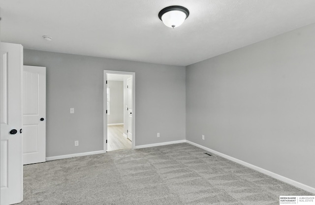 8925 N 159th Ave, Bennington, NE 68007 - spare room with carpet floors and baseboards