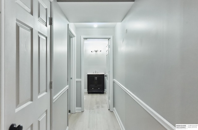 8925 N 159th Ave, Bennington, NE 68007 - hallway with light wood-type flooring and an upstairs landing