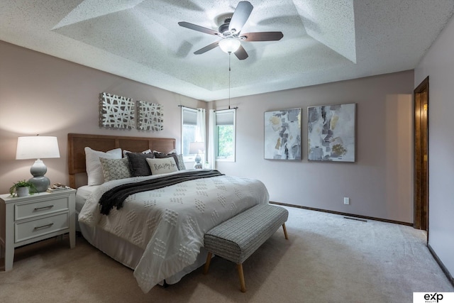 15461 Harney St, Omaha, NE 68154 - carpeted bedroom with a tray ceiling, baseboards, a textured ceiling, and ceiling fan