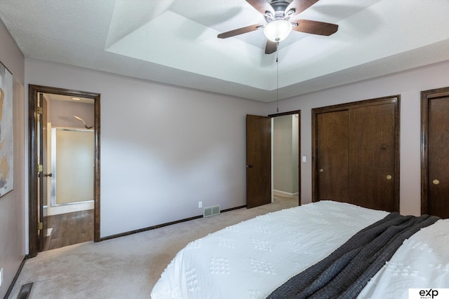 15461 Harney St, Omaha, NE 68154 - bedroom featuring light colored carpet, multiple closets, baseboards, and a ceiling fan