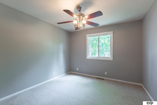 15461 Harney St, Omaha, NE 68154 - spare room featuring ceiling fan, light colored carpet, baseboards, and a textured ceiling