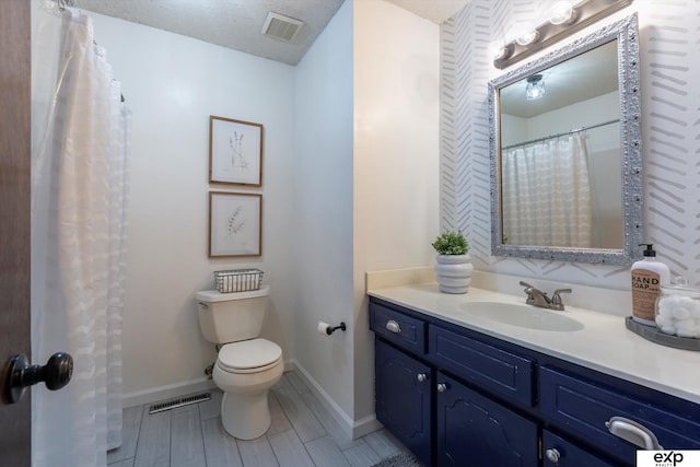 15461 Harney St, Omaha, NE 68154 - bathroom featuring toilet, vanity, and baseboards