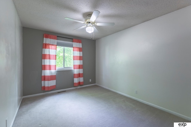 15461 Harney St, Omaha, NE 68154 - carpeted empty room with a textured ceiling, baseboards, and a ceiling fan