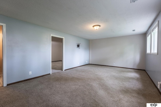 15461 Harney St, Omaha, NE 68154 - carpeted spare room with a textured ceiling and baseboards