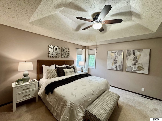 15461 Harney St, Omaha, NE 68154 - carpeted bedroom with a raised ceiling, baseboards, and ceiling fan