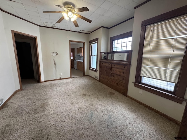 1725 S 23rd St, Lincoln, NE 68502 - carpeted entryway featuring ceiling fan, baseboards, and crown molding