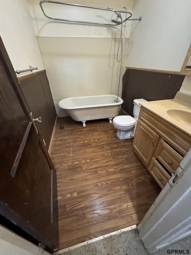 1725 S 23rd St, Lincoln, NE 68502 - full bath with a freestanding tub, vanity, toilet, wood finished floors, and a shower