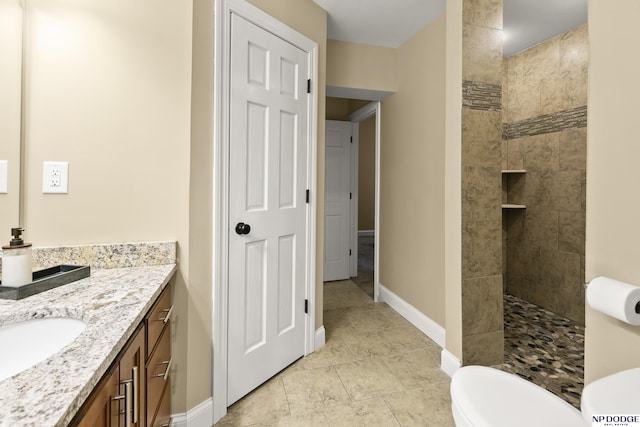 S-1020 Platte Shore Dr, Fremont, NE 68025 - bathroom featuring walk in shower, vanity, baseboards, and toilet