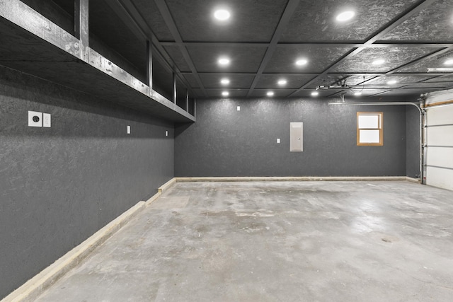 S-1020 Platte Shore Dr, Fremont, NE 68025 - garage featuring recessed lighting, a textured wall, electric panel, and baseboards