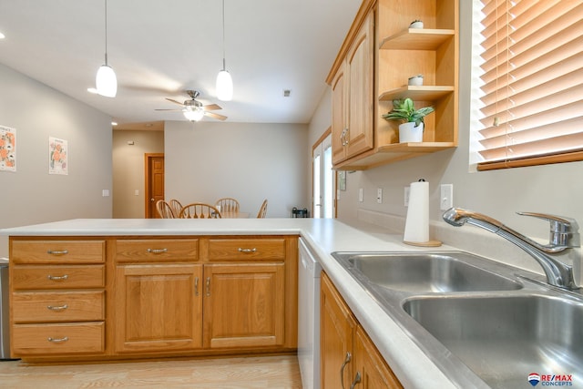 3934 Ballard Ct, Lincoln, NE 68504 - kitchen featuring a sink, open shelves, a peninsula, light countertops, and dishwasher