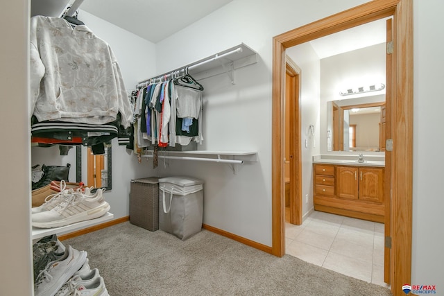 3934 Ballard Ct, Lincoln, NE 68504 - spacious closet featuring light colored carpet, a sink, and light tile patterned floors