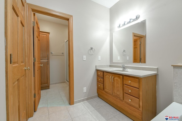3934 Ballard Ct, Lincoln, NE 68504 - bathroom with vanity, tile patterned flooring, and baseboards