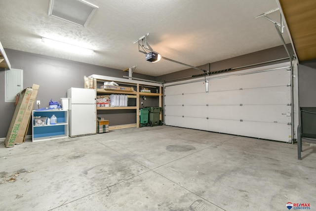3934 Ballard Ct, Lincoln, NE 68504 - garage with freestanding refrigerator and a garage door opener
